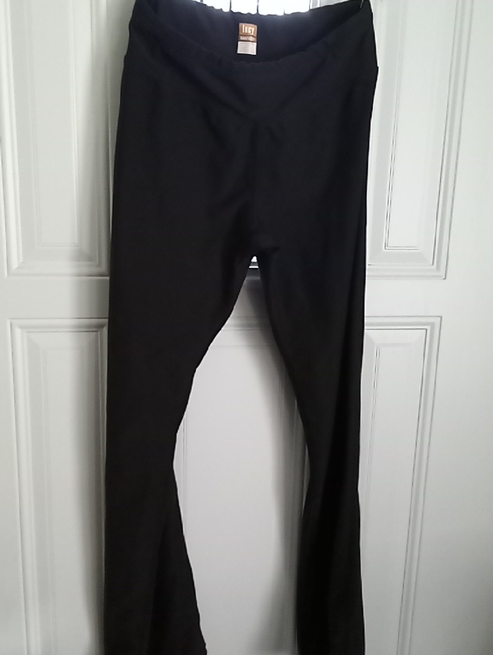 Lucy Black Activewear Top with Orange Logo Label